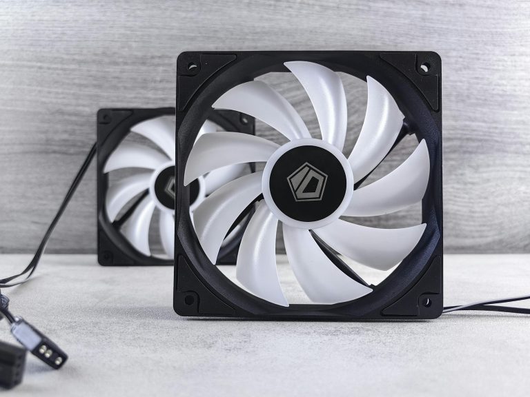 A pair of black and white fans with a white cable