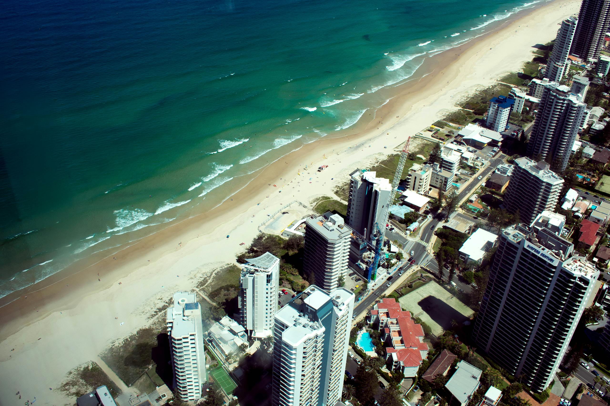 A stunning aerial view of Gold Coast's beachfront skyline, showcasing the azure ocean and sandy shores.