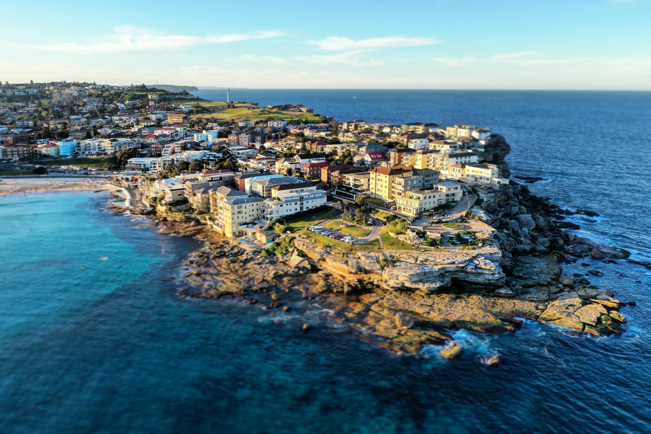 Explore the stunning aerial view of North Bondi's coastline in Sydney, Australia with crystal clear waters and iconic architecture.